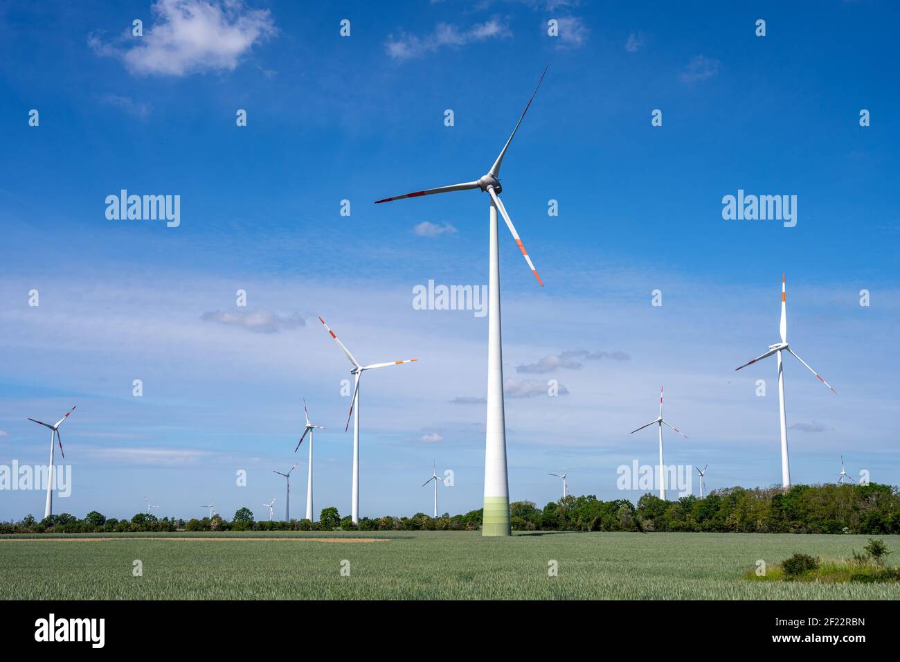 Wind turbines on a sunny day seen in Germany Stock Photo
