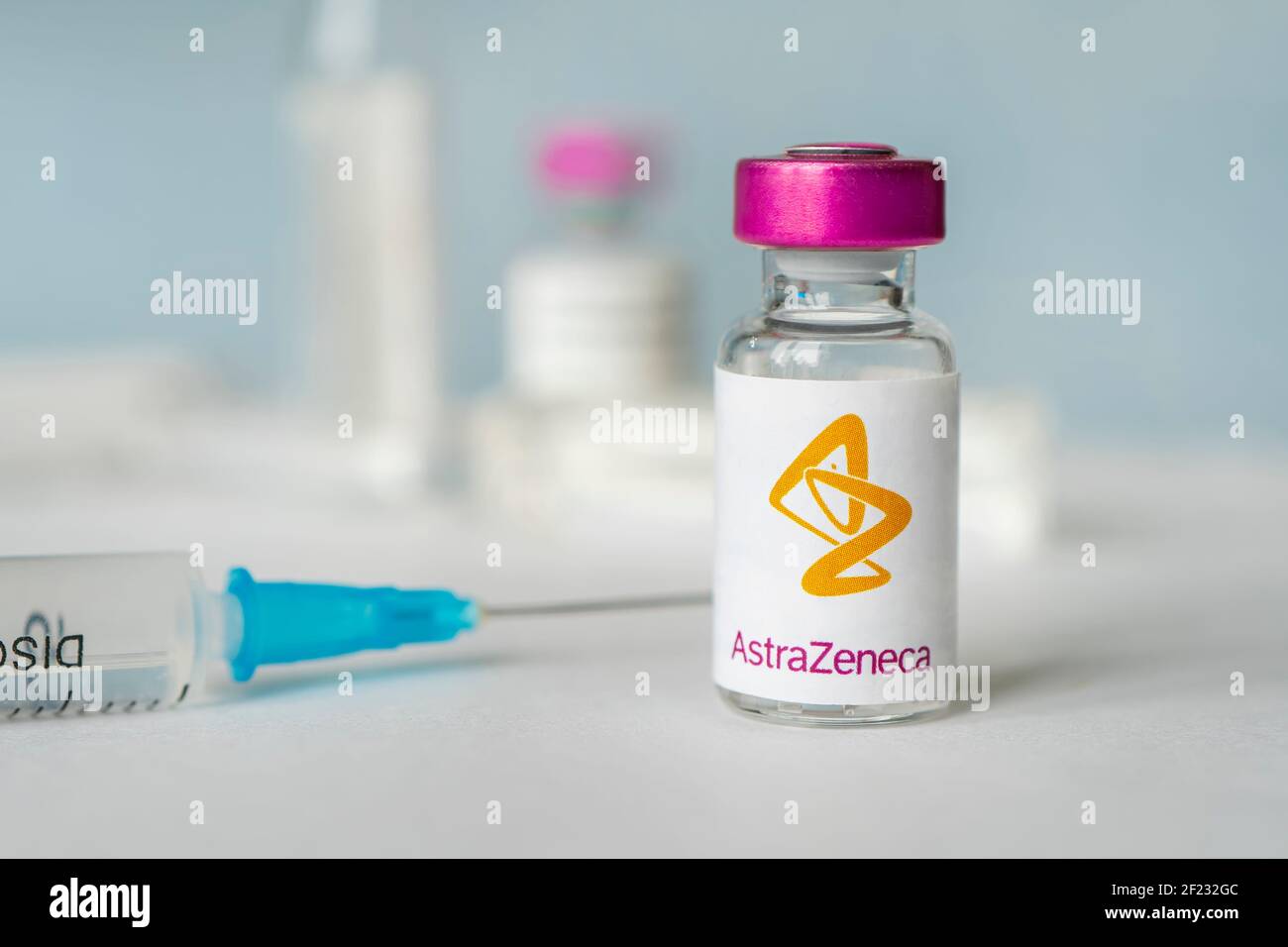 logo of the astrazeneca company on a glass bottle with liquid for injections. february 27, 2021, Barnaul, Russia. Stock Photo