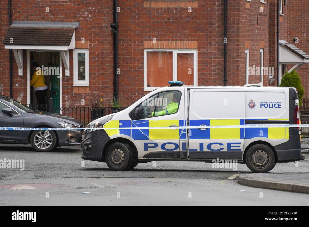 Manchester, UK, 10/03/2021 Police guard a crime scene after a woman was shot last night in north Manchester. Officers were called at 6:00pm to Everside Drive, north Manchester, that a woman in her early 30s had arrived at the hospital with a gunshot wound to her leg. Photo Credit: Ioannis Alexopoulos/Alamy Live News Stock Photo