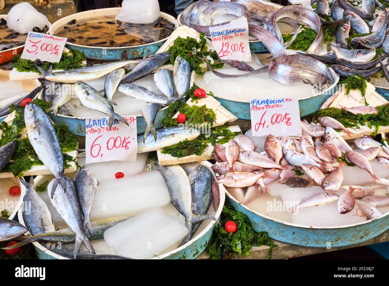 Fish and seafood in bowls at a market in Naples Stock Photo