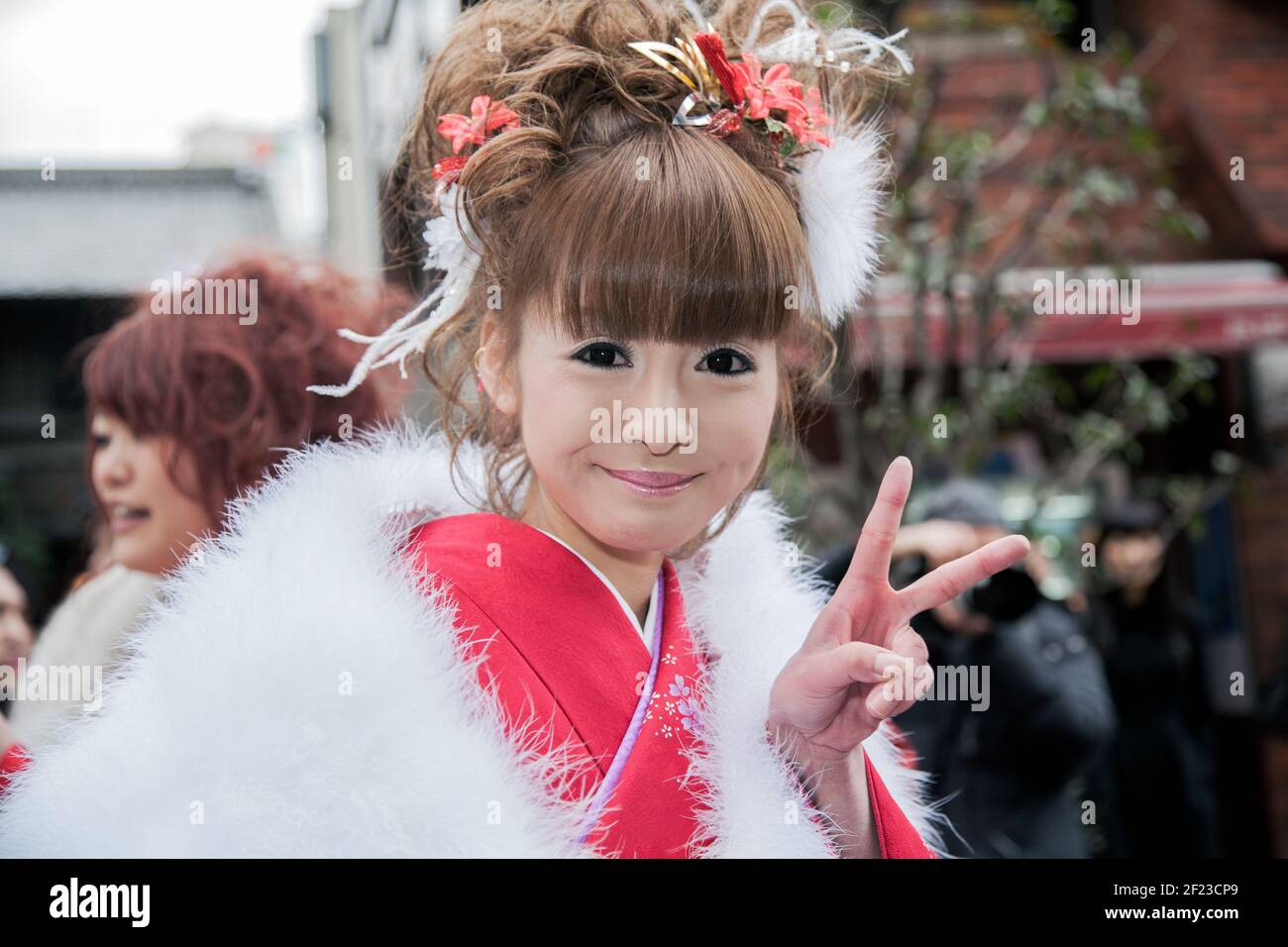 Pretty Japanese lady dressed in kimono on Coming of Age Day (Seijin no hi) to celebrate turning 20 and becoming adults, Asakusa, Tokyo, Japan Stock Photo
