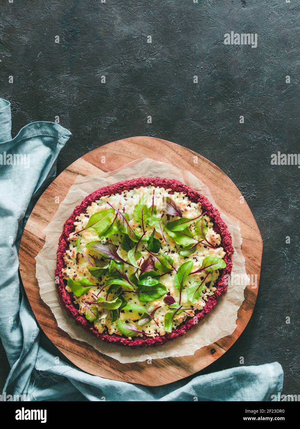 Beetroot pizza crust with fresh mangold leaves Stock Photo
