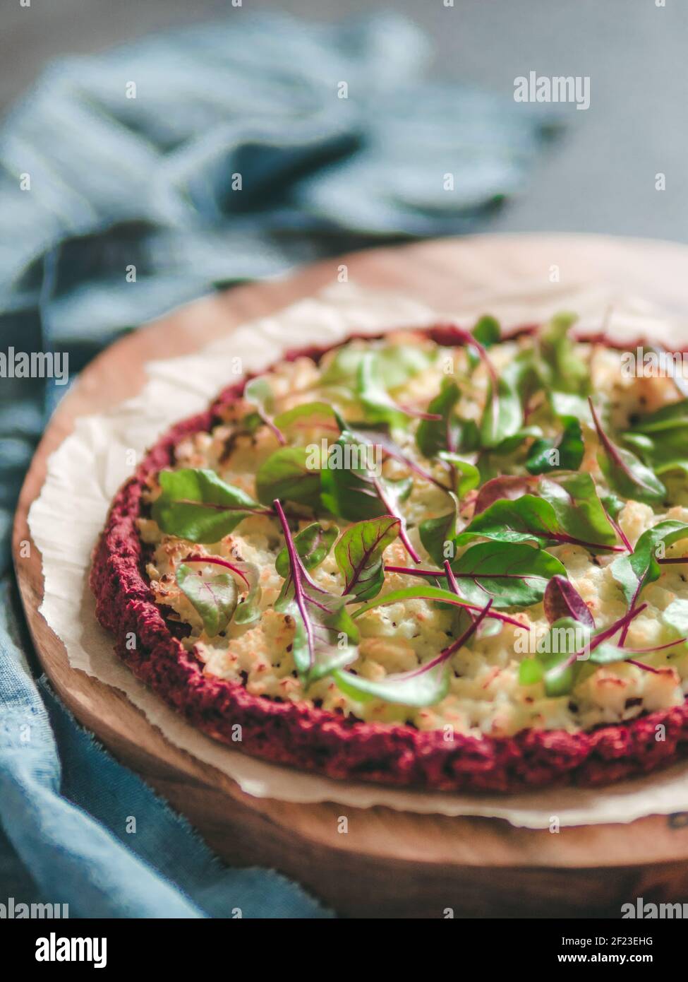 Beetroot pizza crust with fresh mangold leaves Stock Photo