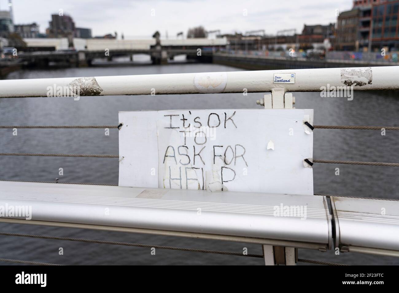 Sign on footbridge crossing River Clyde in Glasgow offering hope to public considering suicide, Scotland, UK Stock Photo