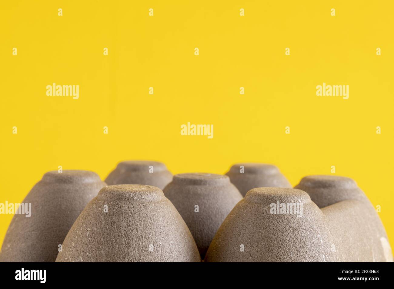 Texture and detail of round shaped upside down egg carton box with plenty of white space above. Stock Photo