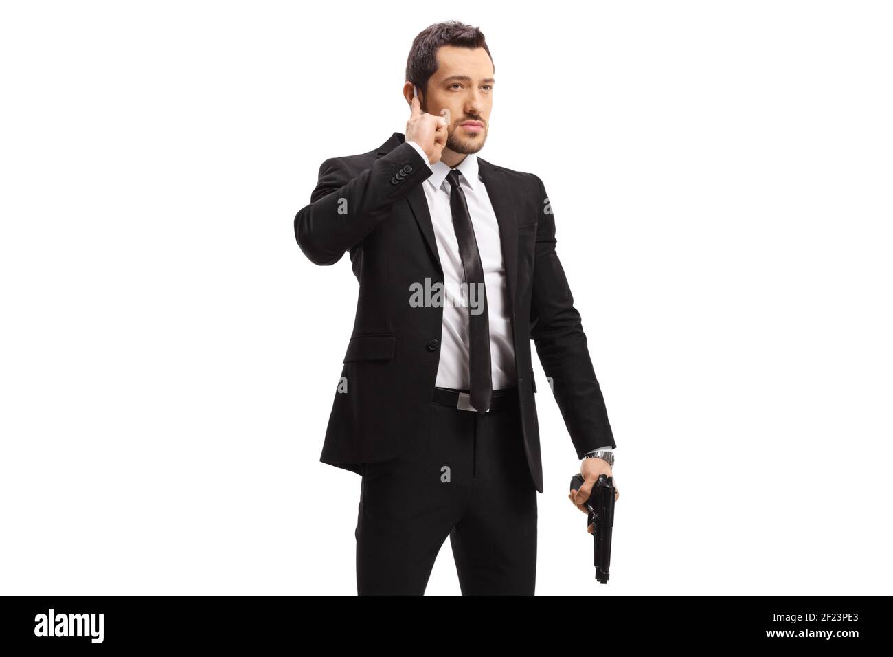 Bodyguard with a gun isolated on white background copy Stock Photo
