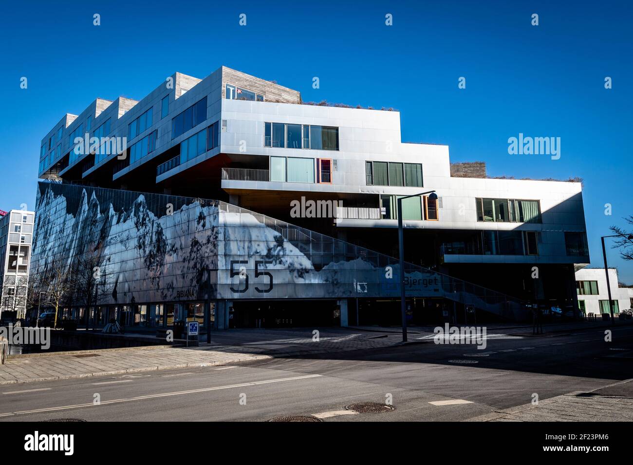 Mountain Dwellings (Danish: Bjerget) is a building in the Ørestad district of Copenhagen, Denmark, consisting of apartments above a multi-story car pa Stock Photo