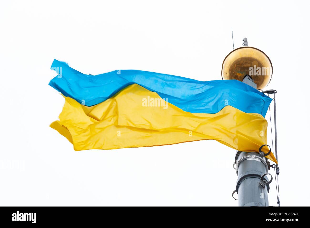 10 march 2021. Lviv, Ukraine. Ukrainian flag waves on the City Hall Ratusha. Stock Photo