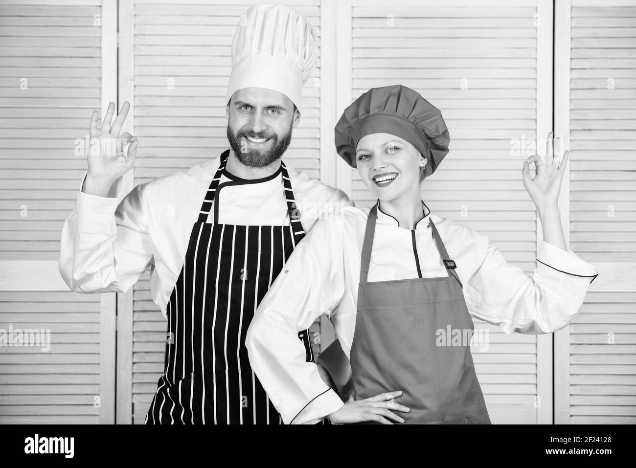 Secret ingredient is love. man and woman chef in restaurant. Menu planning. culinary cuisine. secret ingredient by recipe. cook uniform. Family cooking in kitchen. couple in love with perfect food. Stock Photo