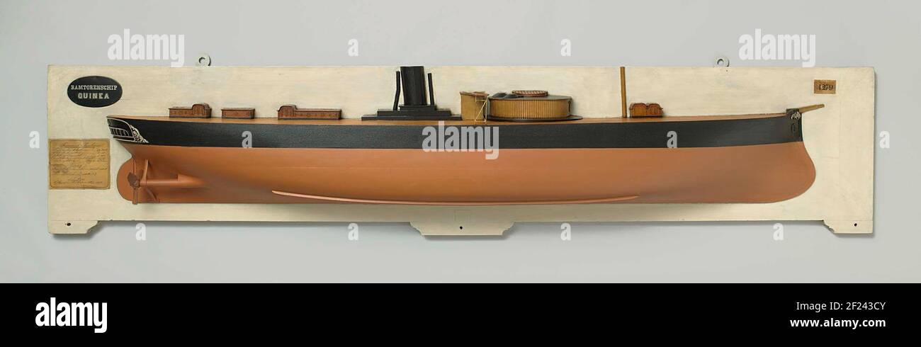 Half model or an ironclad ram ship. Polychromed stack model and semi-model (starboard) of a ram tower vessel. It has a rounded ramsteven, decorated with leaf motifs at the top, a cruiser gate with lights and carving of tendrils, a stir with rounded stirring blade and one of a pair of three-leaf screws with adjustable urgency. On the deck is a single gun dome with a large area of ​​hatch and two round target domes; Behind the dome the bridge with a gangway with grilles cross-shears, a chimney, two chattered crosses on the stern and spread over the deck different cupboards. A mast on the fore sh Stock Photo