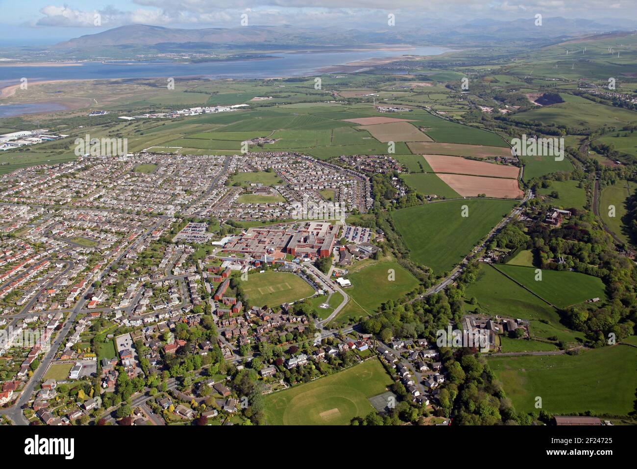 aerial view of the Hawcoat side of Barrow-in-Furness including Furness General Hospital & Barrow Cricket Club, looking north to the Lake District Stock Photo