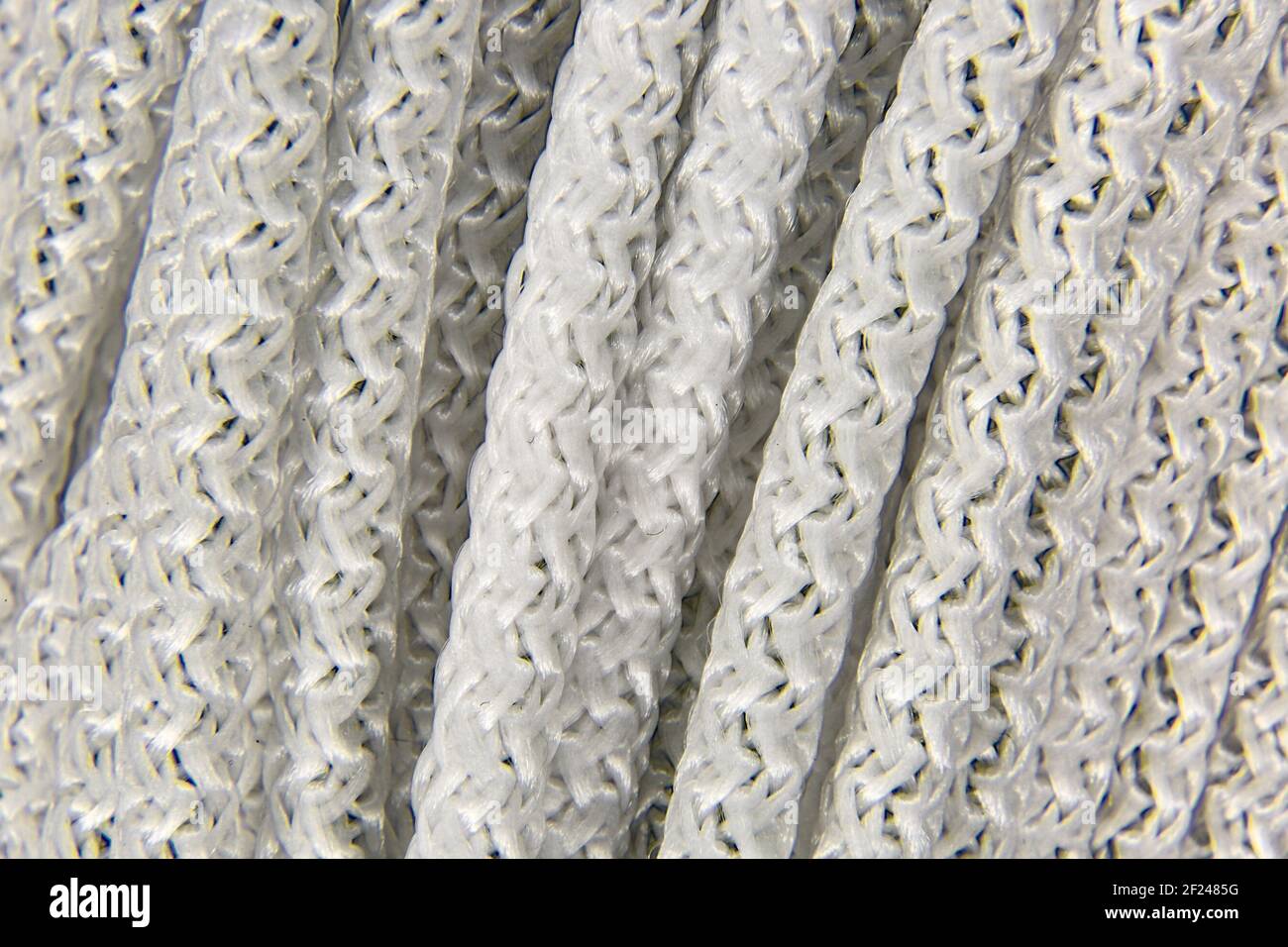 Image background of a piece of white braided rope Stock Photo