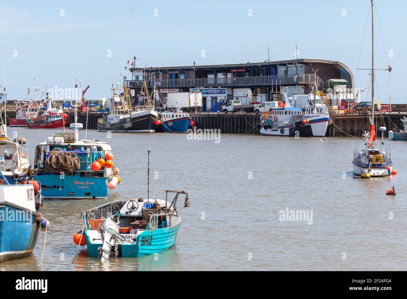 Boats moored at the fish quay in Bridlington, East Yorkshire to unload their catch Stock Photo