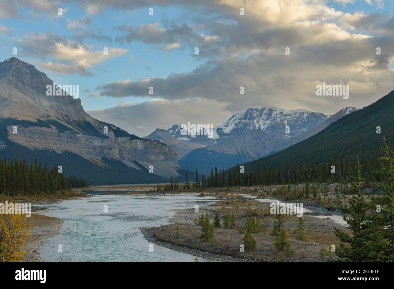Glacial River and Mountains in the Rockies Stock Photo