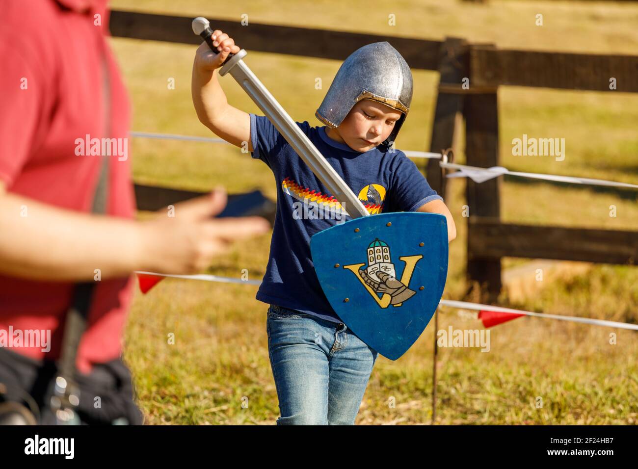 Russia. Vyborg. 08.20.2020 a child in toy medieval armor with a sword Stock Photo