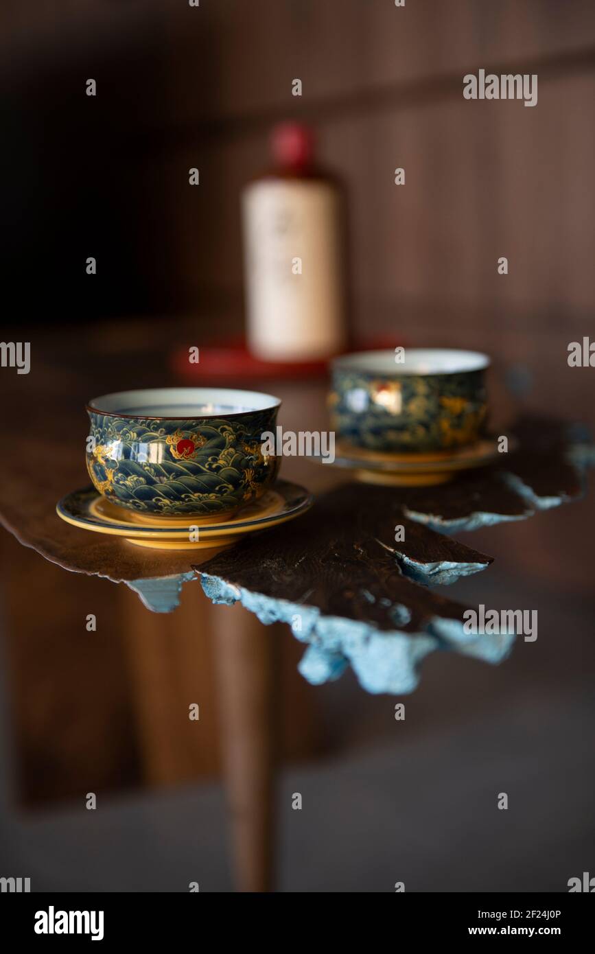 Two interesting oriental cups on a table inspired by Japanese art Stock Photo