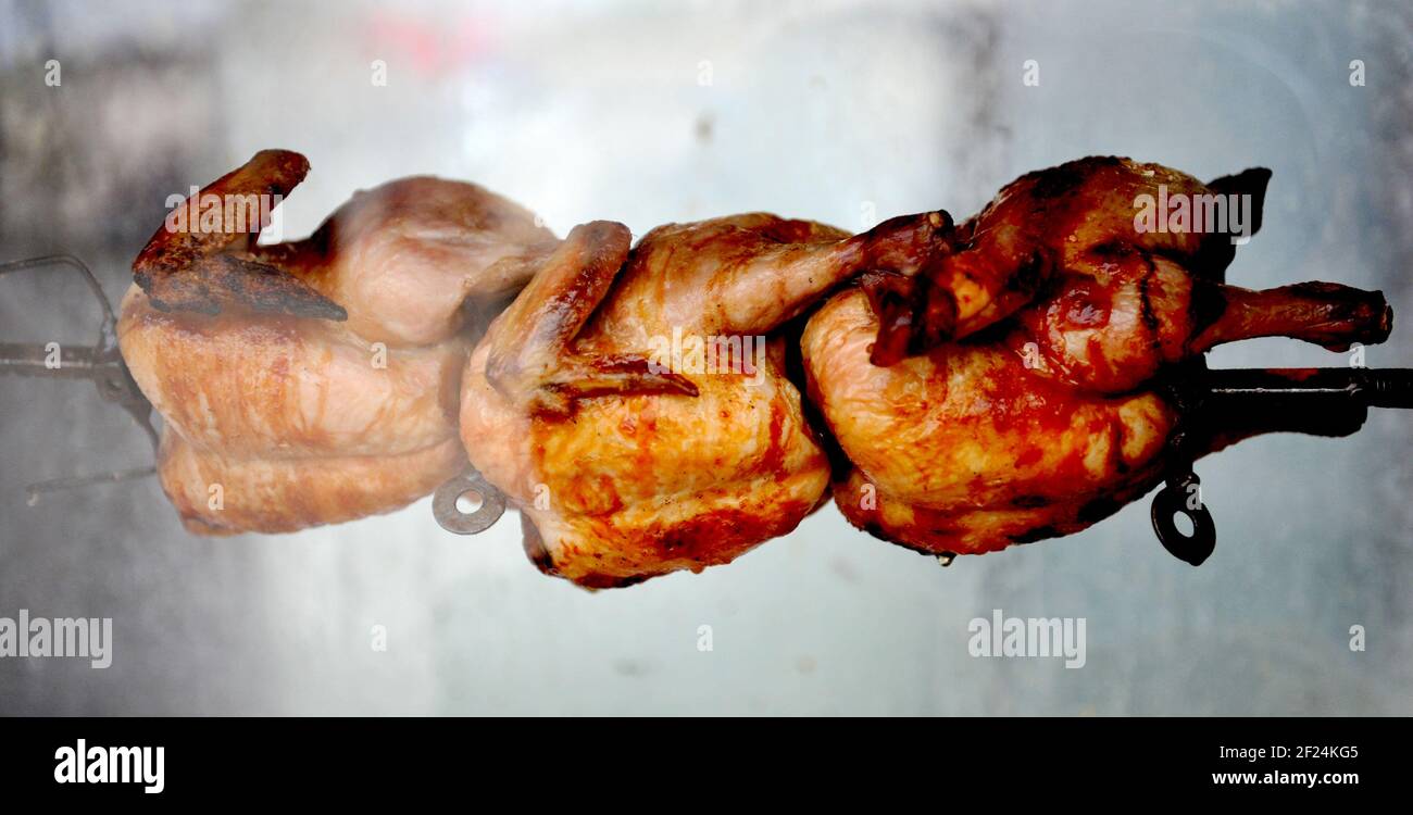 Rotate Cook Chicken Rotating machine are grilled chicken, whole chicken Stock Photo - Alamy