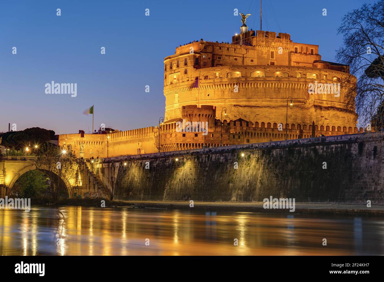 The Castel Sant Angelo and the Tiber river in Rome at night Stock Photo