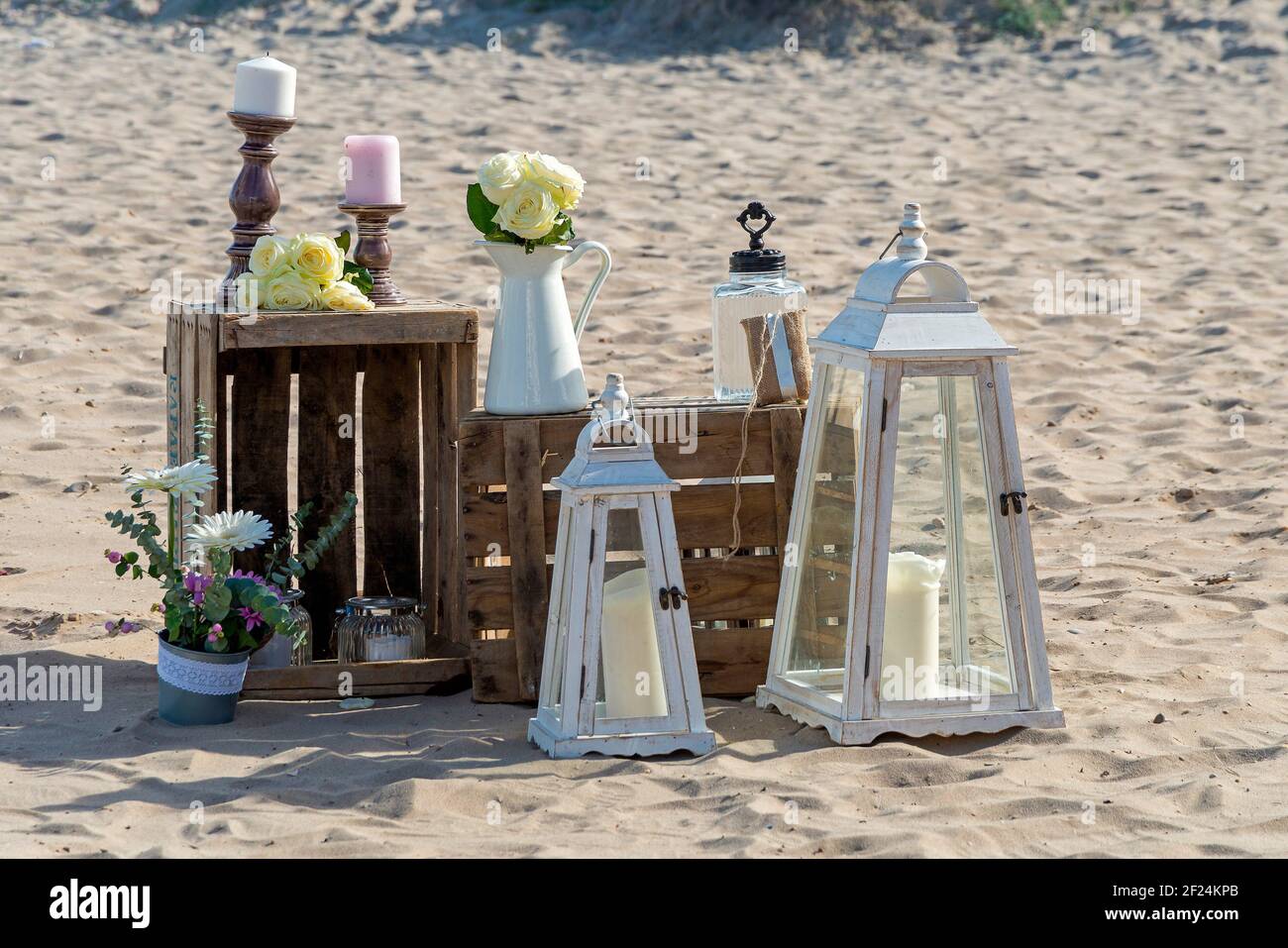 Beautiful decorations of the wedding set on the sand of the beach