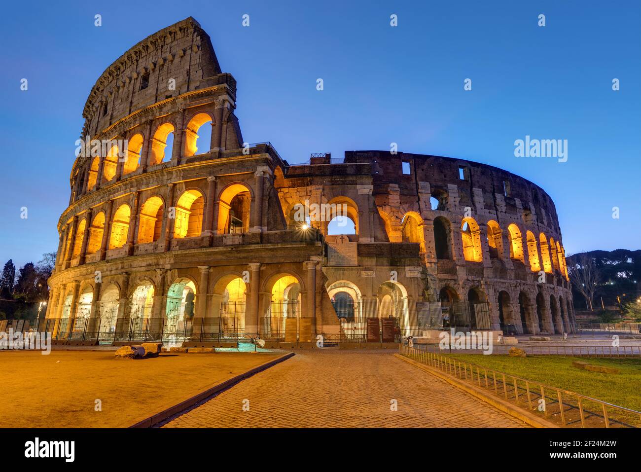 The famous Colosseum in Rome illuminated at twilight Stock Photo