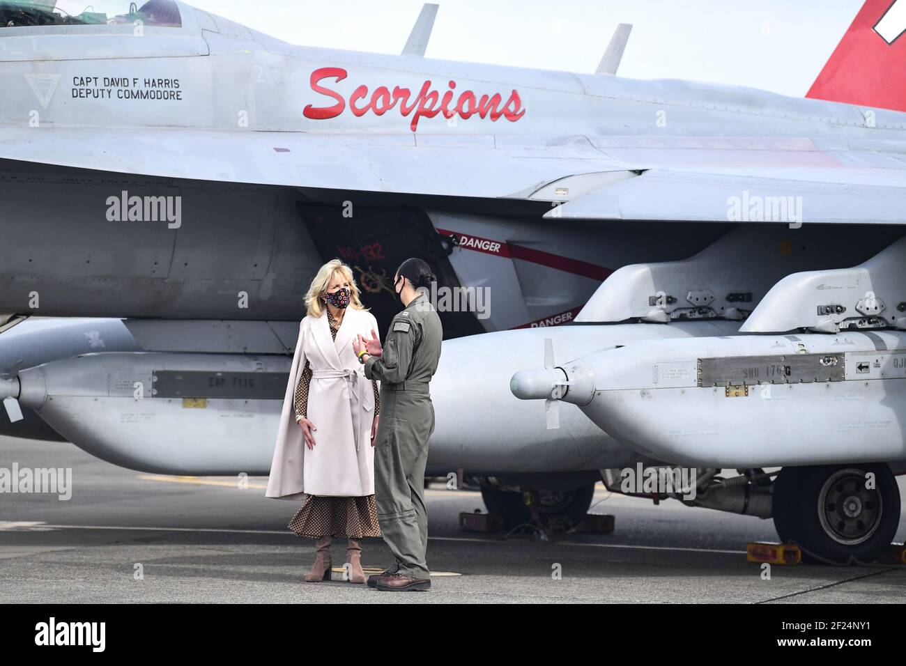 U.S First Lady Dr. Jill Biden speaks with Lt. Cate Oakley, a EA-18G Growler fighter pilot, during her visit to the flight line at Naval Air Station Whidbey Island March 9, 2021 in Oak Harbor, Washington. The First Lady visited the base to show support for military members and their families, and talk about the Joint Forces Initiative. Credit: Planetpix/Alamy Live News Stock Photo