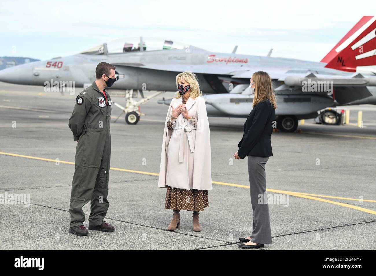 U.S First Lady Dr. Jill Biden speaks with Cmdr. Kerry Hicks, Commanding Officer of VAQ-129, and Mrs. Hicks during her visit to the flight line at Naval Air Station Whidbey Island March 9, 2021 in Oak Harbor, Washington. The First Lady visited the base to show support for military members and their families, and talk about the Joint Forces Initiative. Credit: Planetpix/Alamy Live News Stock Photo