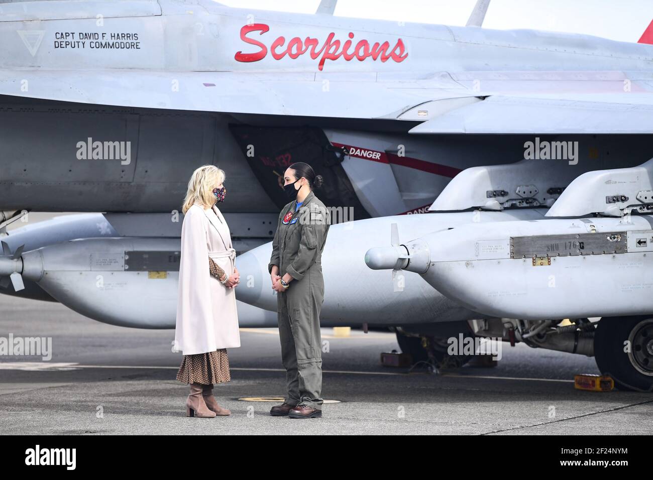 U.S First Lady Dr. Jill Biden speaks with Lt. Cate Oakley, a EA-18G Growler fighter pilot, during her visit to the flight line at Naval Air Station Whidbey Island March 9, 2021 in Oak Harbor, Washington. The First Lady visited the base to show support for military members and their families, and talk about the Joint Forces Initiative. Credit: Planetpix/Alamy Live News Stock Photo