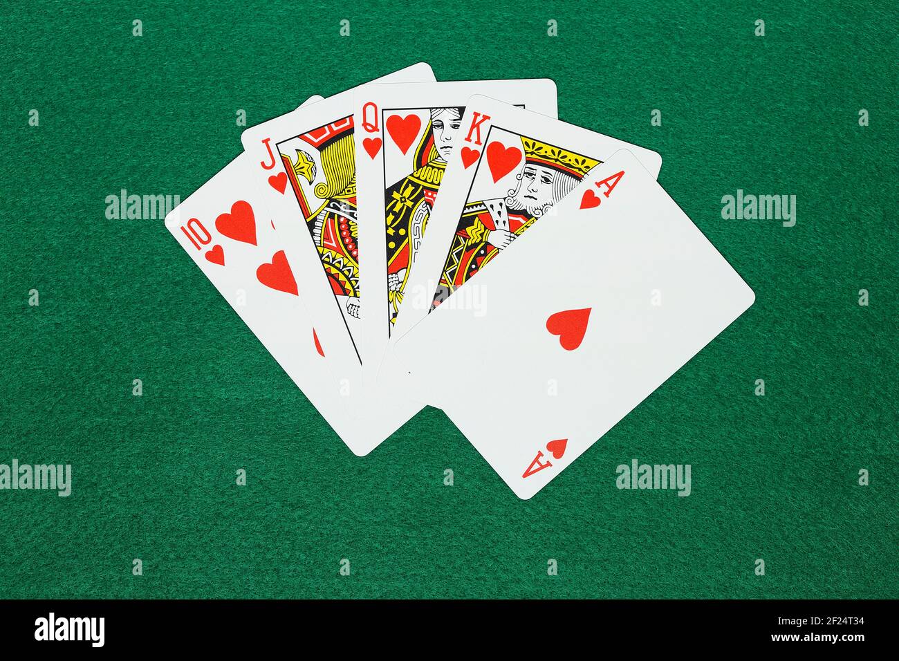 hand of royal flush on green felt Stock Photo