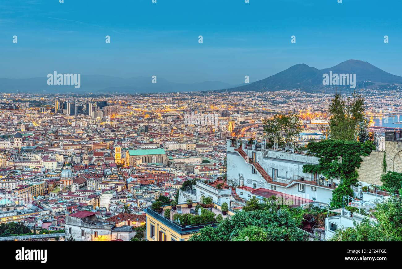 Naples in Italy with Mount Vesuvius at dusk seen from Vomero hill Stock Photo