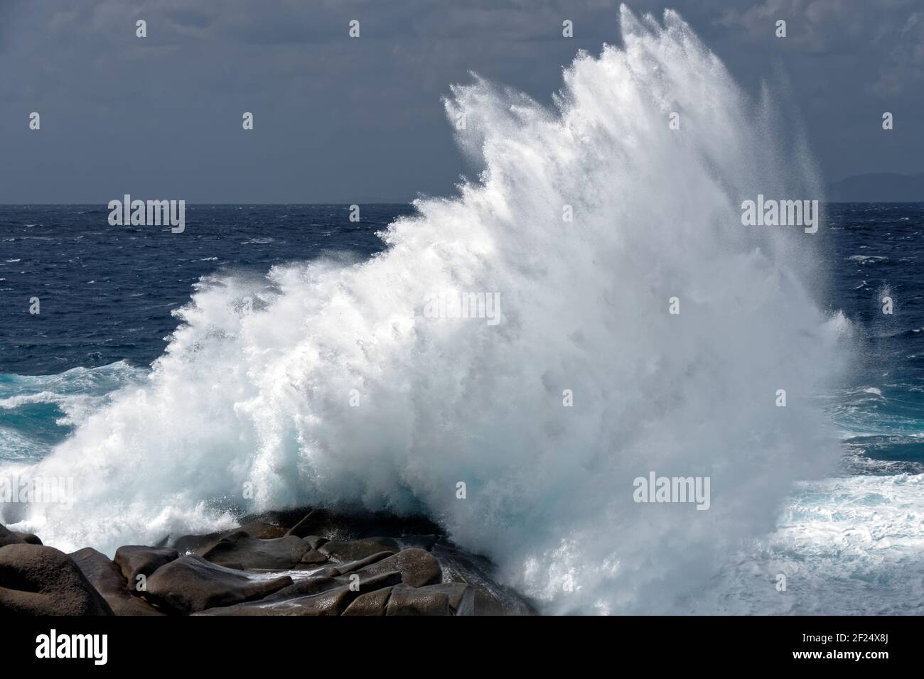 Waves Pounding the Coastline at Capo Testa Sardinia Stock Photo