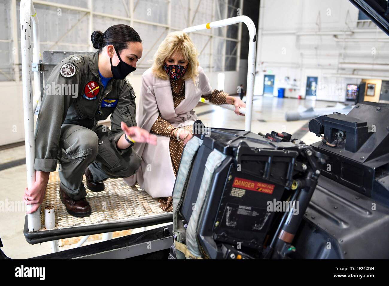 U.S First Lady Dr. Jill Biden is show the cockpit of a EA-18G Growler fighter jet by pilot Lt. Cate Oakley, during a visit to the flight line at Naval Air Station Whidbey Island March 9, 2021 in Oak Harbor, Washington. The First Lady visited the base to show support for military members and their families, and talk about the Joint Forces Initiative. Stock Photo