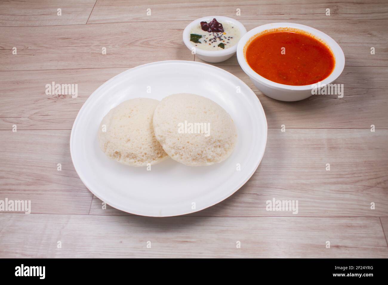 Indian rice cake with lentil curry. South Indian breakfast. Idali