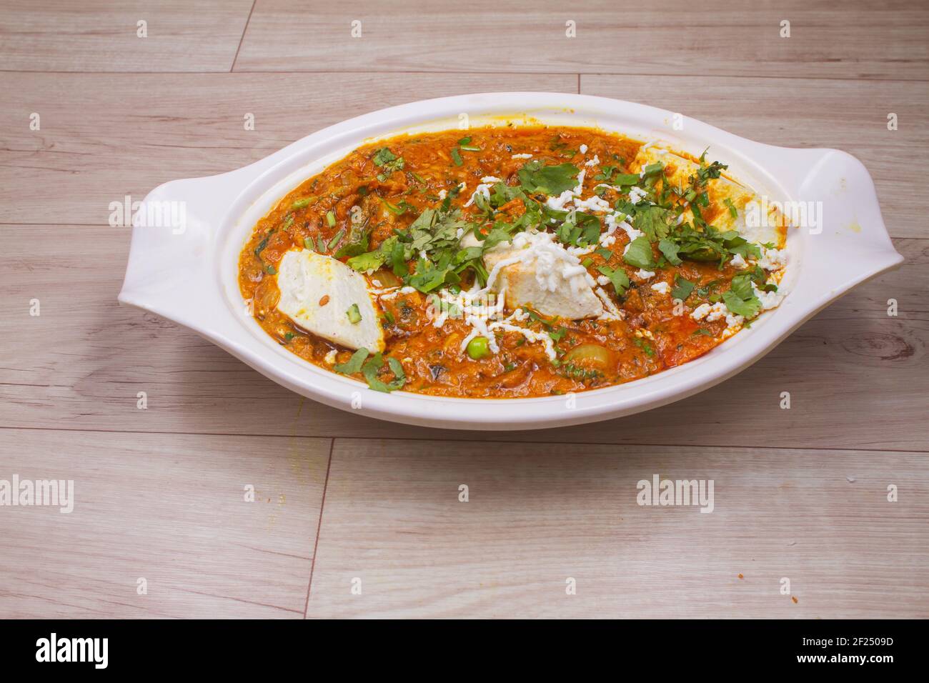 indian dish Paneer masala or paneer lachhedar served in bowl on wooden background Stock Photo