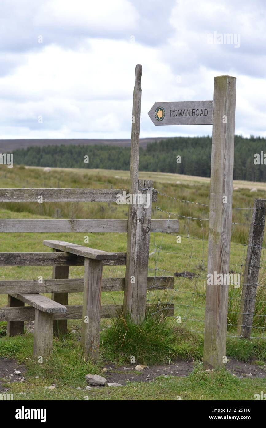 Fence Stile North Yorkshire Moors - Roman Road Wooden Sign - Walking Pathway Over Moorland  - Wooden Stile With High Handle - Public Right Of Way - UK Stock Photo