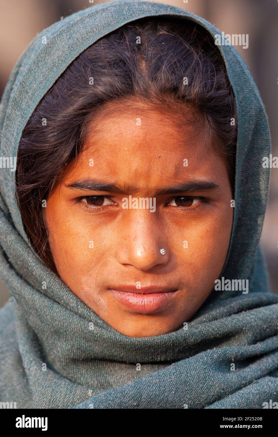 Beautiful girl looking menacingly dangerously from under the forehead Stock  Photo - Alamy