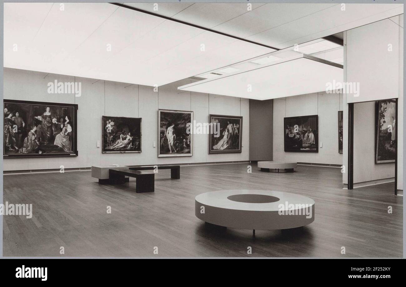 Room with paintings and banks for visitors; Exhibition God and the Goden.from Left to Right Hanging in this room The City of Leiden Receives The Cloth Industry Through Abraham van den Temple, Jupiter and Callisto by Caesar van Everdingen, Venus and Sleeping Mars by Ferdinand Bol, and Venus and Adonis by Jacob Backer. On The Right Wall in The Corner, The Judgment of Count Willem is exhibited by Nicolaes van Galen. Stock Photo