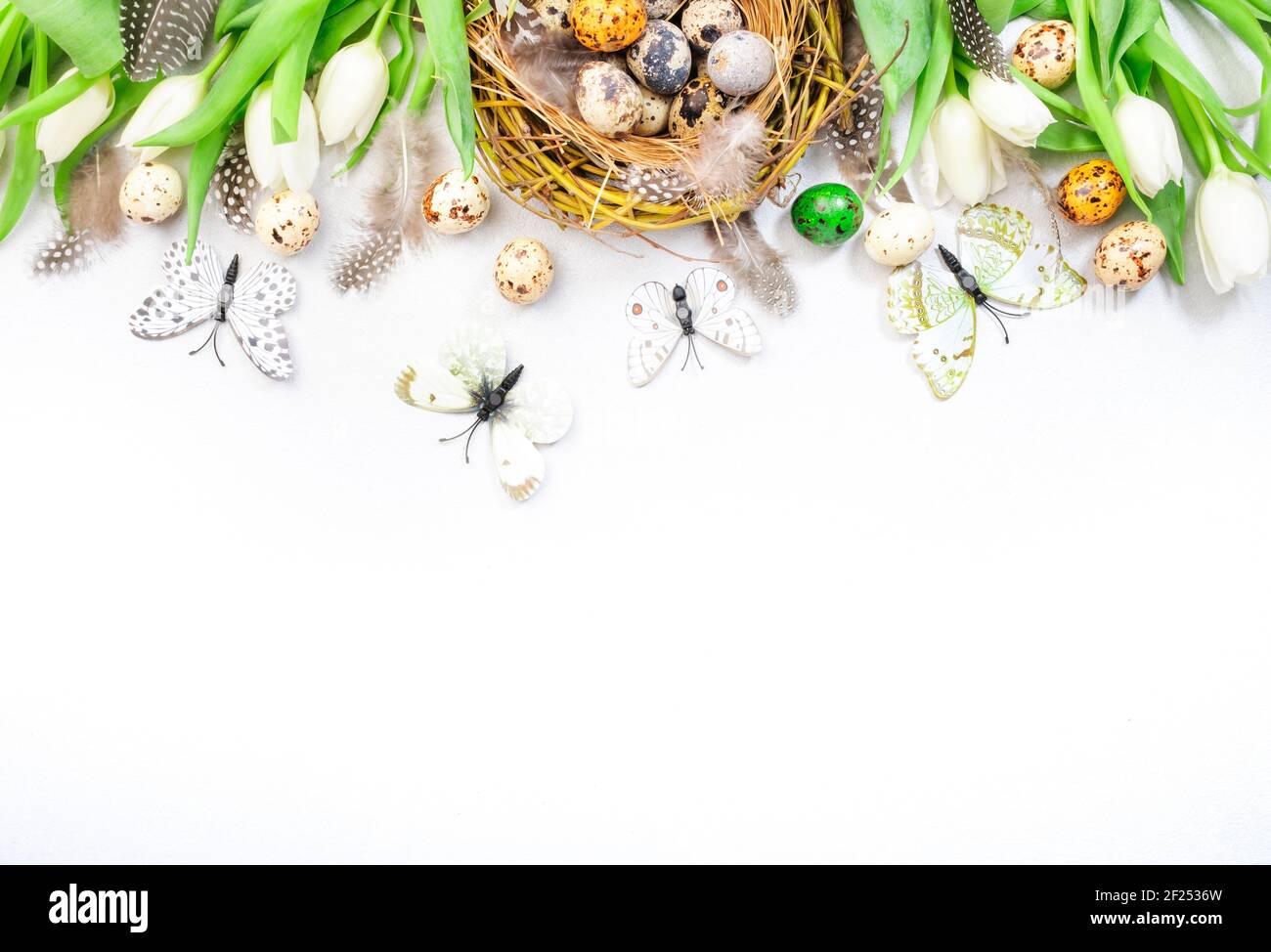 Spring Easter holiday white background with tulips, quail eggs ...