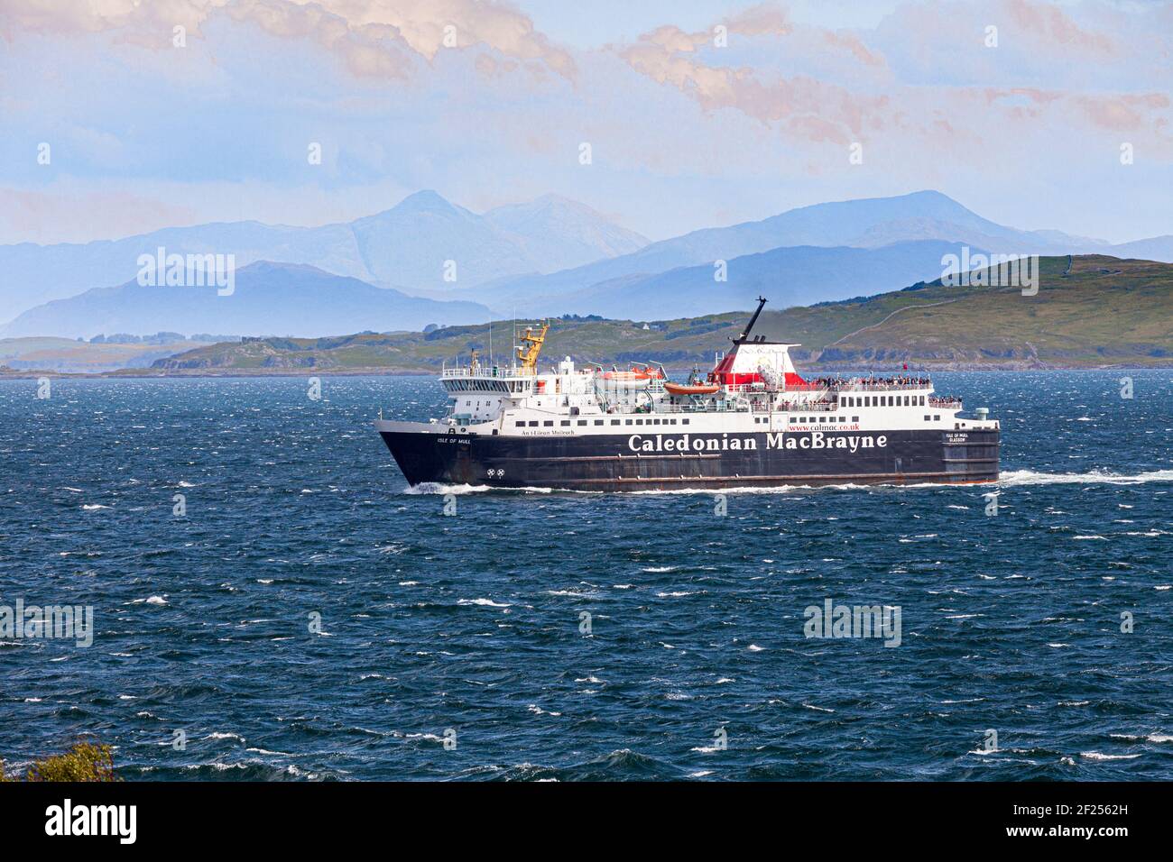 The 'Isle of Mull' Caledonian MacBrayne ferry from the Scottish mainland at Oban approaching the Isle of Mull over a choppy sea, Argyll and Bute Stock Photo