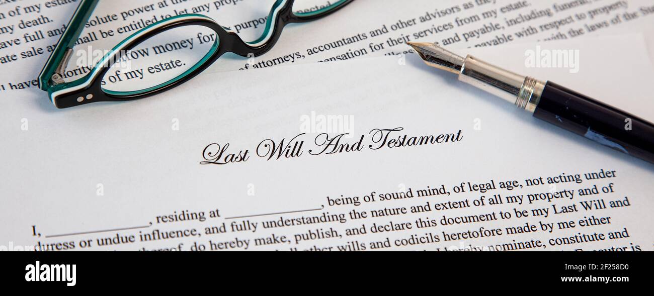 Last Will And Testament Document With Fountain Pen and eyeglasses for Signing. Death And Inheritance Stock Photo