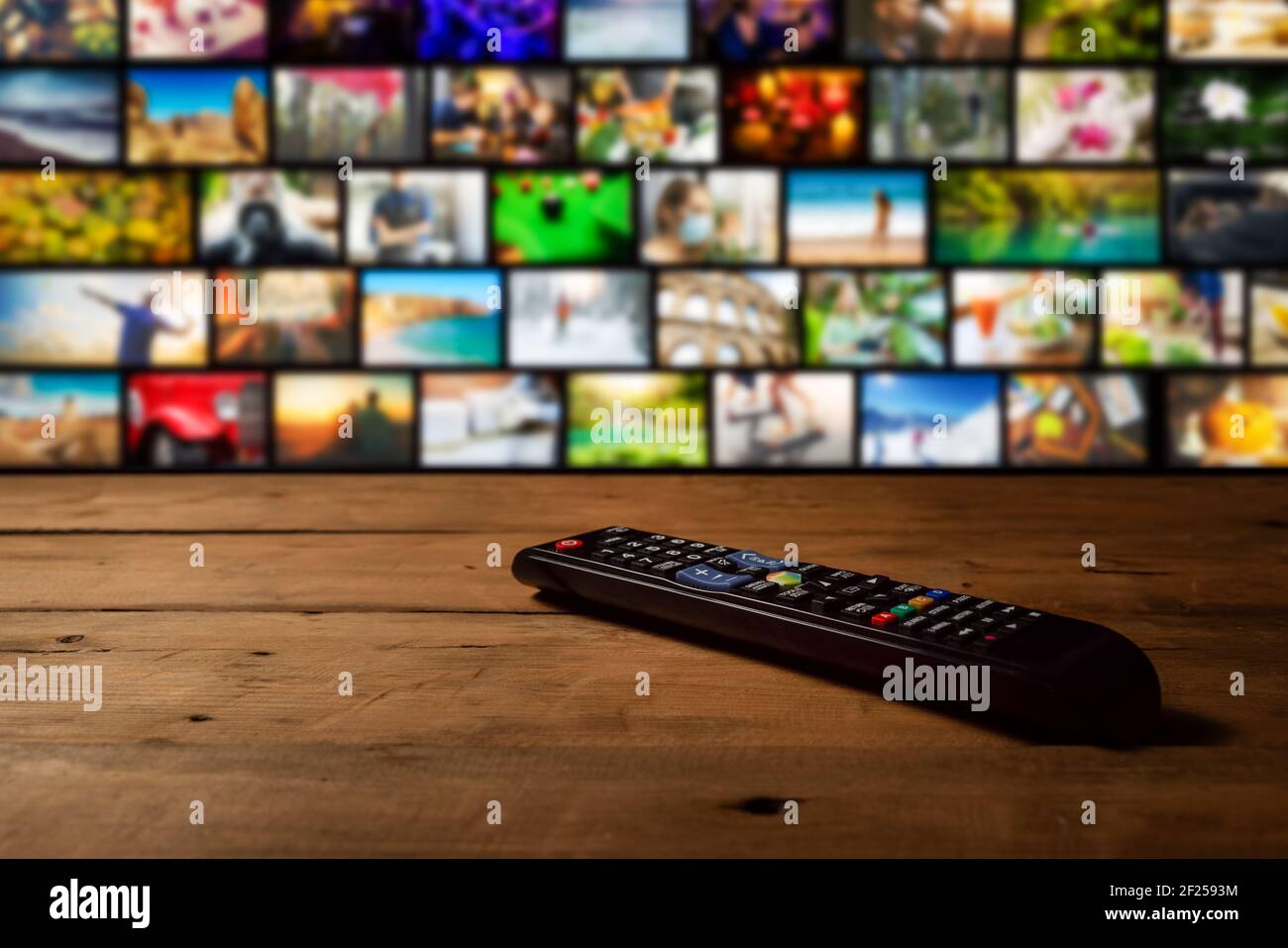 smart tv interactive television - channel collage with remote control on the table Stock Photo