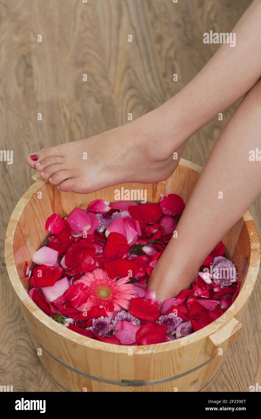 A young woman takes a foot bath Stock Photo Alamy