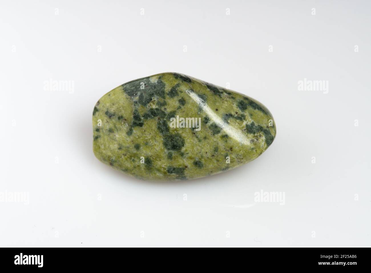 Natural stone green serpentine on a white background Stock Photo Alamy