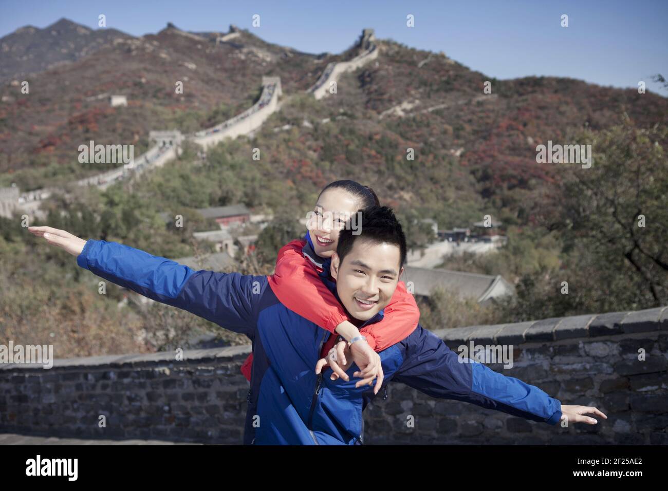 Young couples take pictures in the Great Wall Tourism Stock Photo