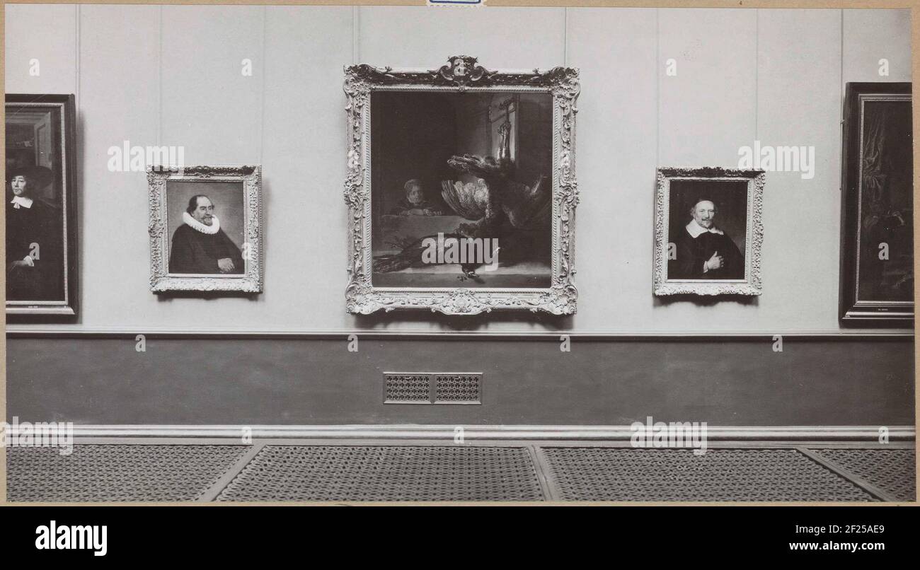 Room with paintings by the early rembrandt school, including portraits