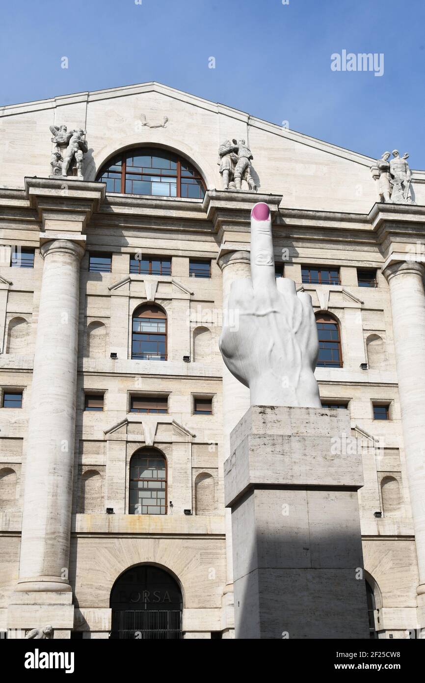 Milan, Italy. 10th Mar, 2021. Milan, Italy The Finger LOVE sculpture by the artist Maurizio Cattelan in Piazza Affari in front of the Milan Stock Exchange with the nail painted pink in the claim of the artist Ivan Tresoldi named Love Assai. In the photo: the pink painted nail of the sculpture the LOVE finger Credit: Independent Photo Agency/Alamy Live News Stock Photo