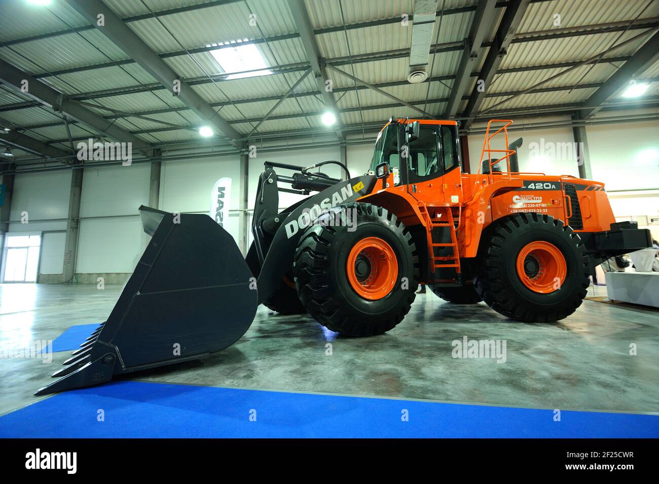 New model of the bulldozer Doosan parked on a stand Stock Photo - Alamy