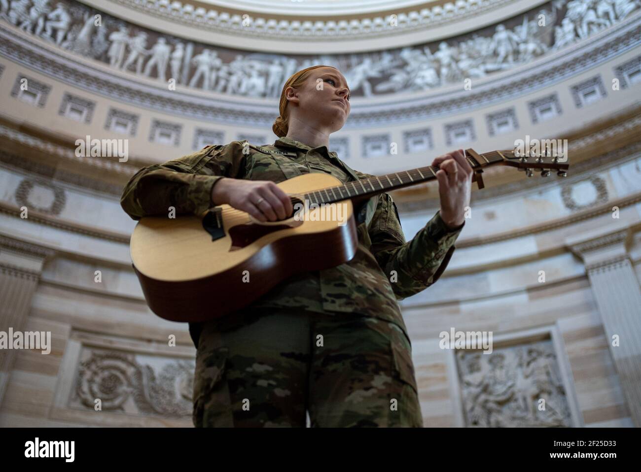 Washington, United States. 10th Mar, 2021. Army Sgt. Hannah Boulden with the  Michigan National Guard sings and plays guitar in the Rotunda of the U.S.  Capitol in Washington, DC on Wednesday, March