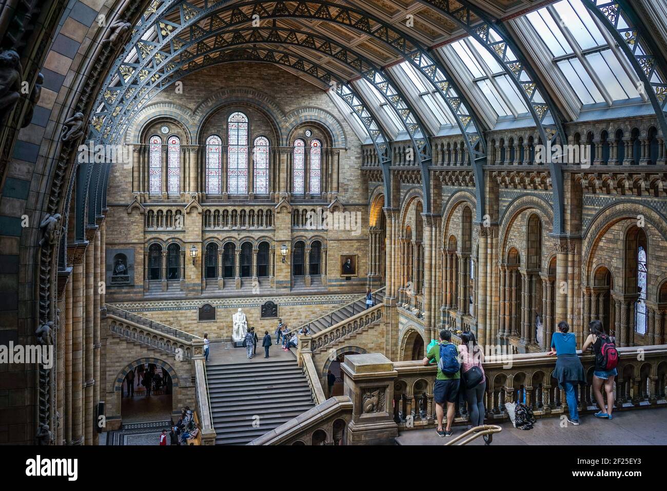 People Looking over a Balcony at the Natural History Museum in London Stock Photo