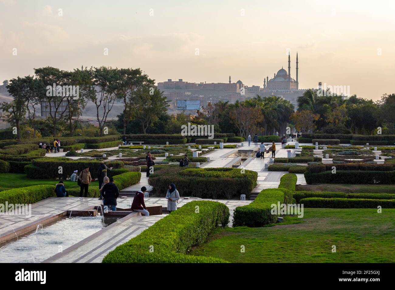 Local Egyptians enjoying the gardens at Al Azhar Park with Cairo Citadel in background, Salah Salem St, El-Darb El-Ahmar, Cairo, Egypt Stock Photo