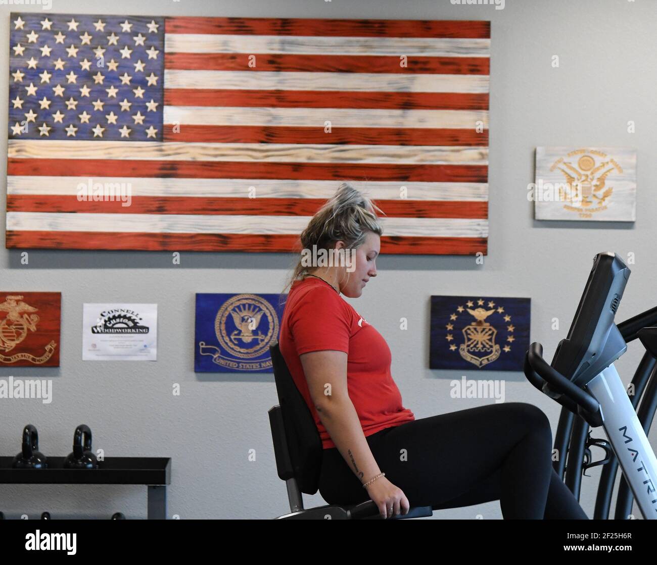 People exercise at a gym in Wylie, Texas on Wednesday, March 10, 2021. Texas governor Greg Abbott fully rescinded the statewide mask order and is allowing business to reopen at full capacity allowing each business to determine their own mask requirements.    Photo by Ian Halperin/UPI Stock Photo